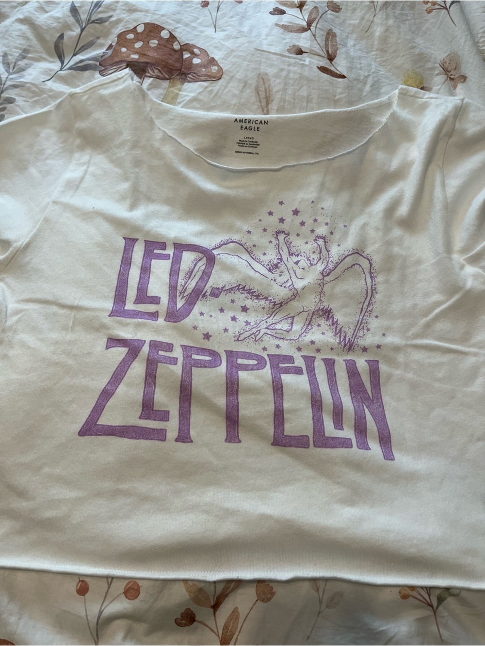 American Eagle off the shoulder White Tee with Purple Graphic Stars